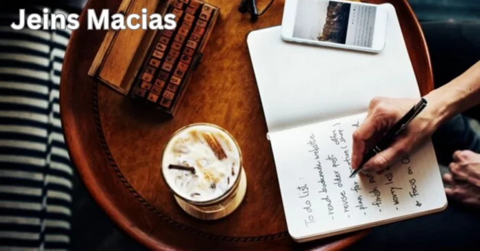 a hand writing in a notebook jeins macias